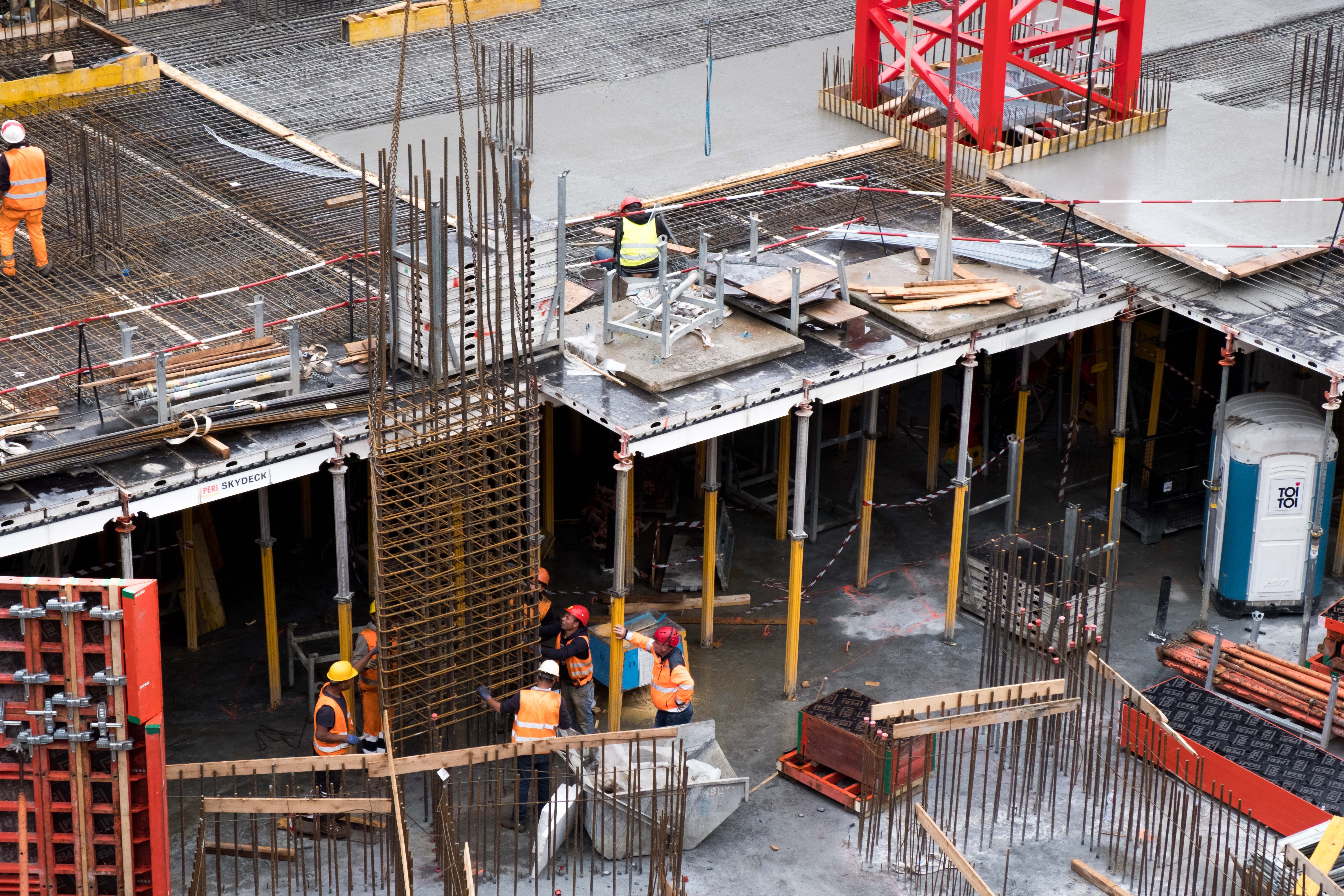 Professional construction team working on a project with safety equipment